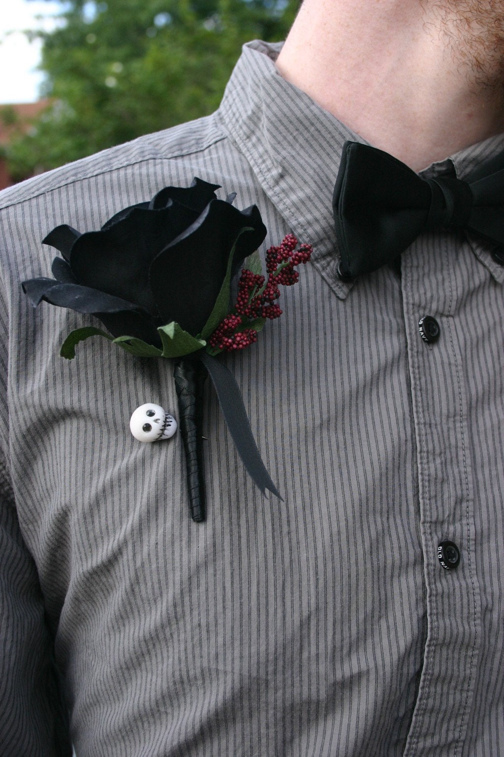 black lapel rose and skull corsage pin