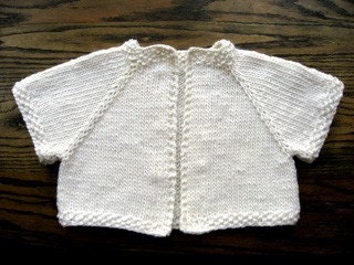 Handknit ivory wool shrug with beaded detail