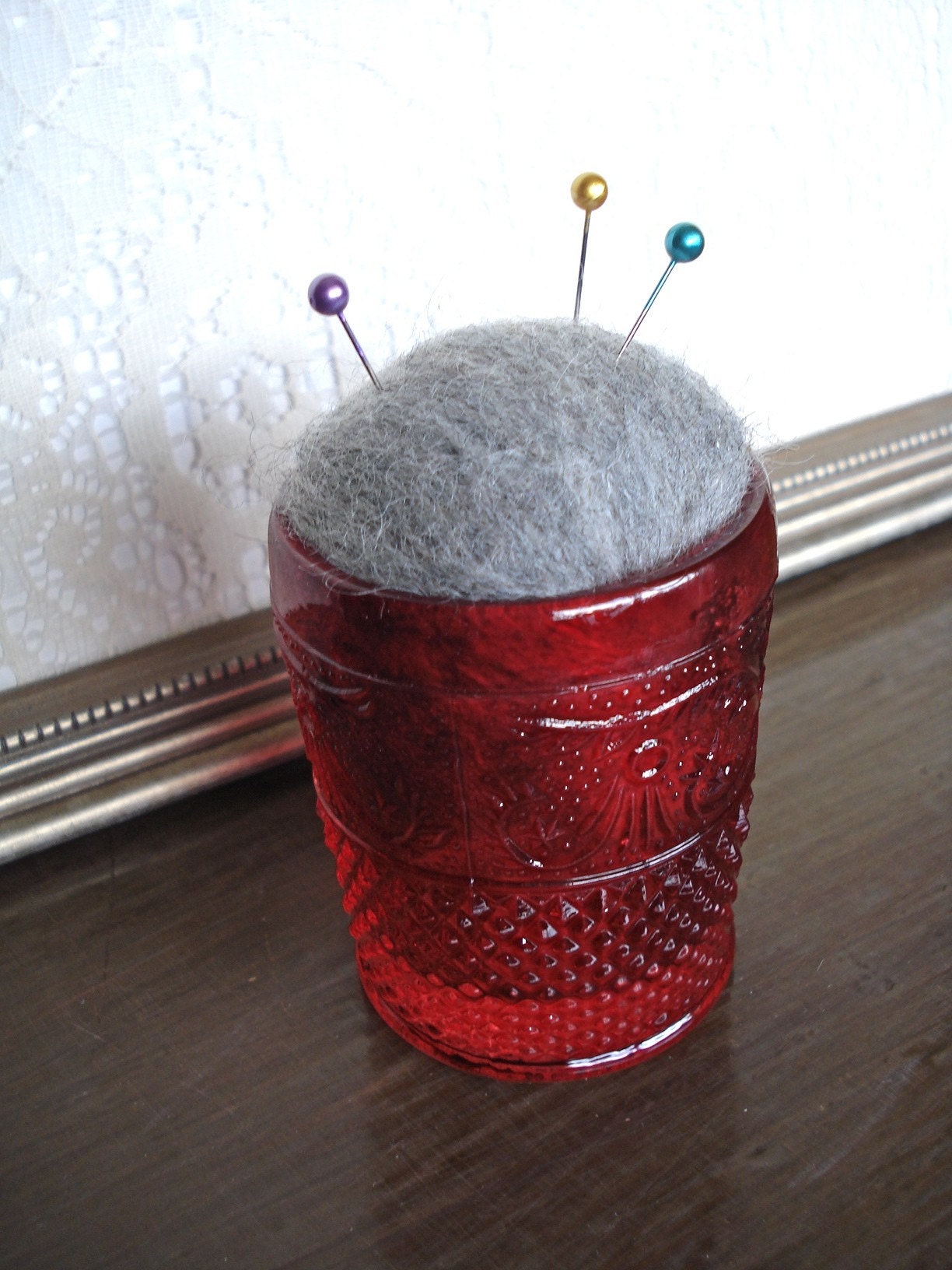 Hand Felted Gray Pincushion in Red Ornate Glass