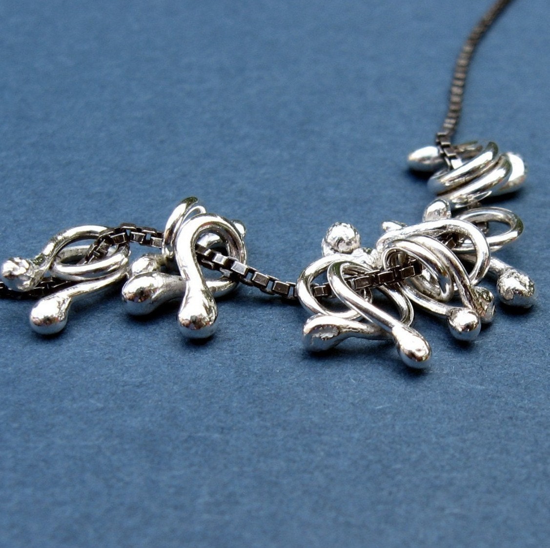 HooBeDoos on an oxidized box chain..  sterling silver