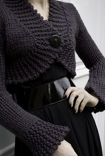 Elegant black sweater with one button in front