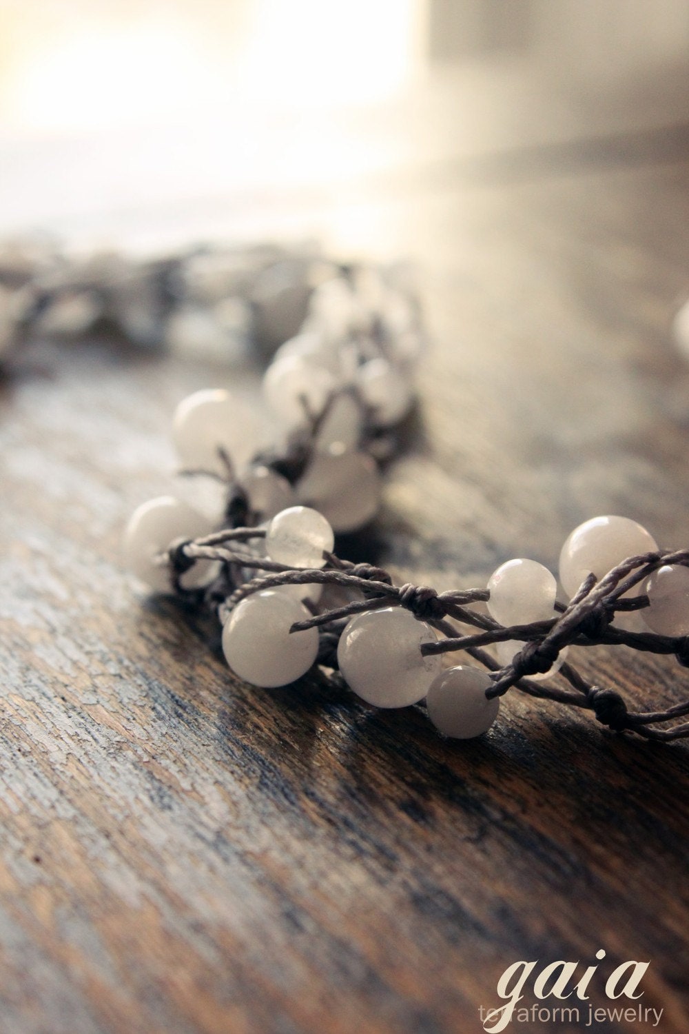 GAIA handmade necklace (long) - snow quartz and warm gray knotted cord.