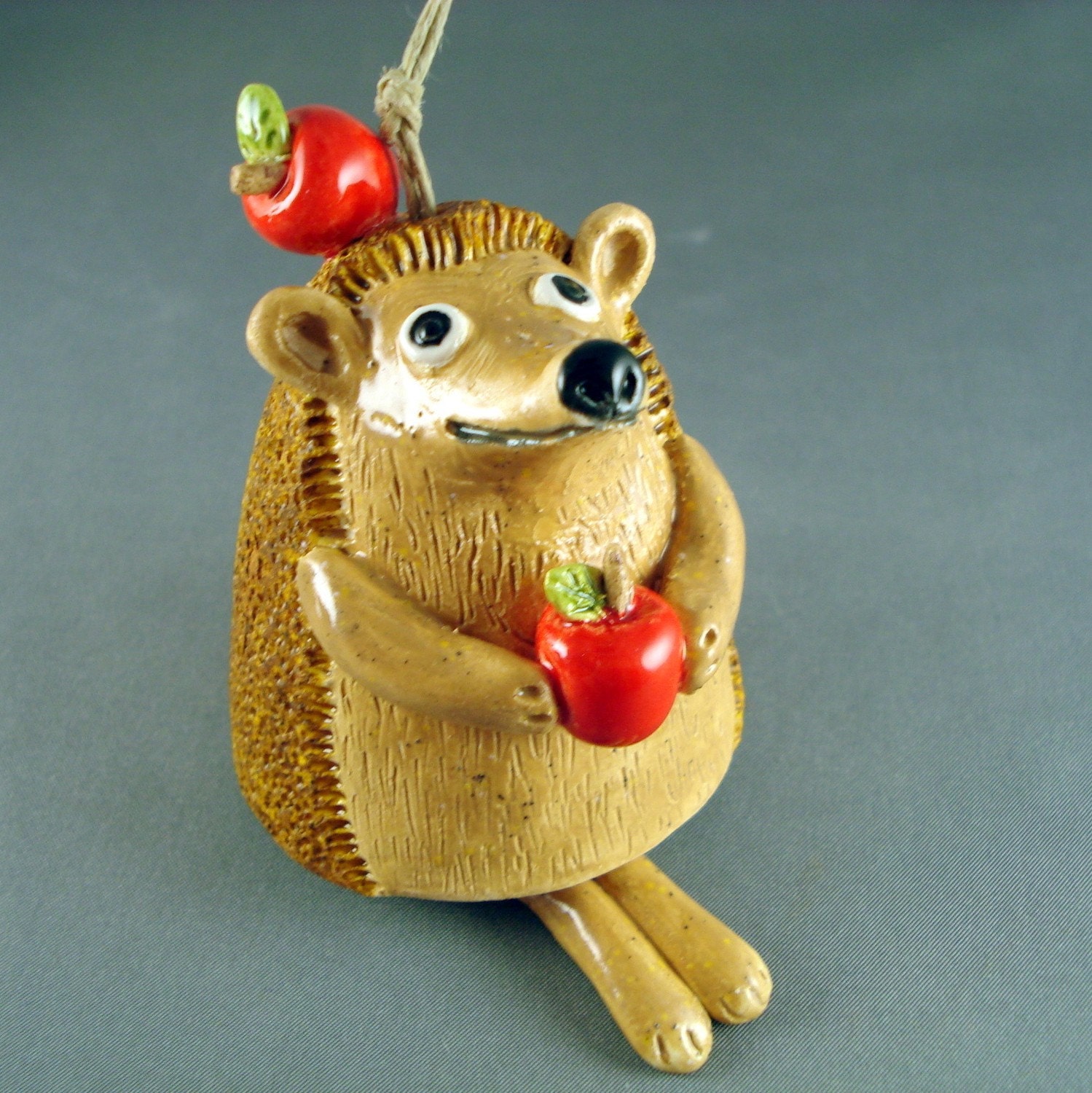 Ceramic bell sculpture Little Hedgehog with apples