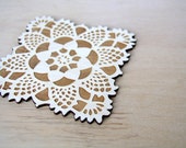 square doily coasters with natural woodgrain