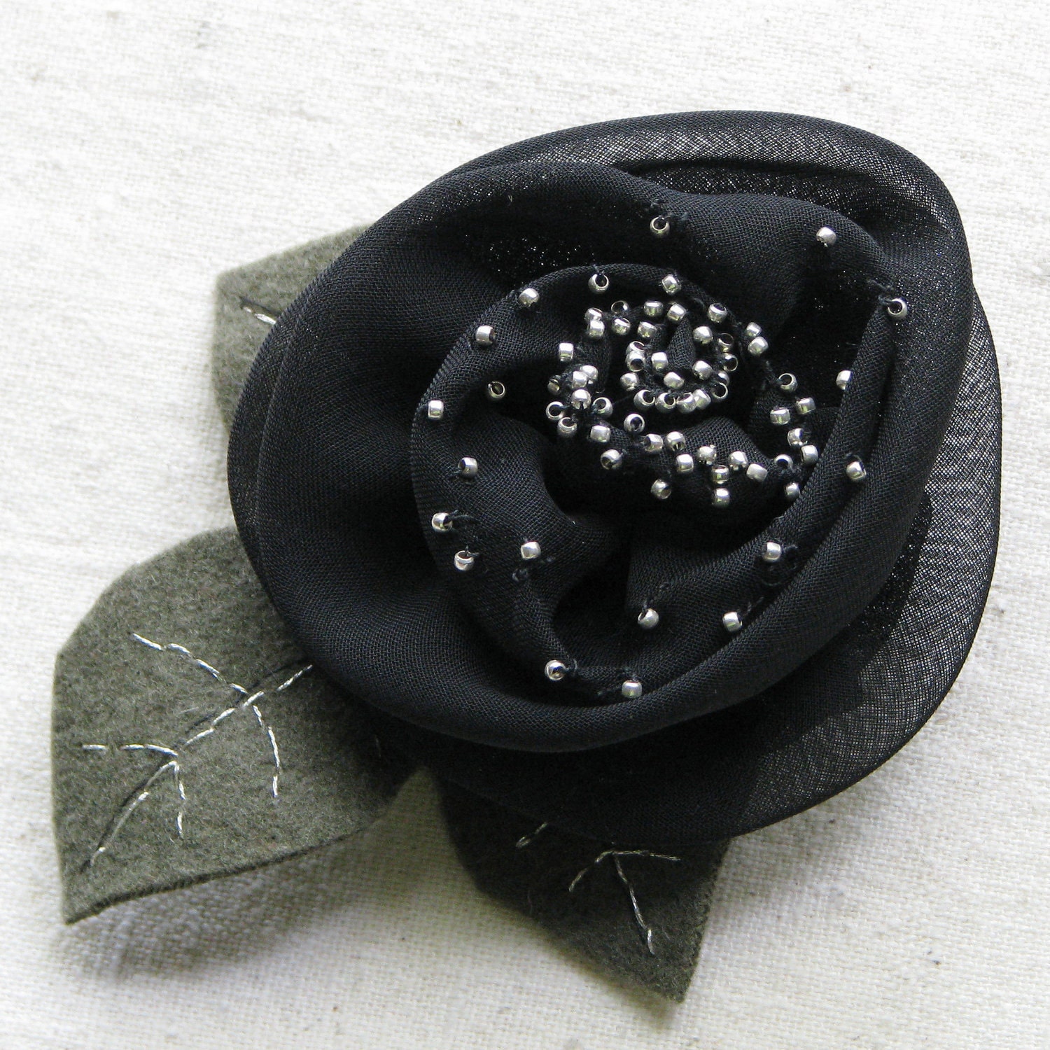 Black rose hair clip, chiffon fabric embellished with silver beads, embroidered moss green felt leaves, large