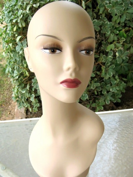 Life sized mannequin head with pierced ears