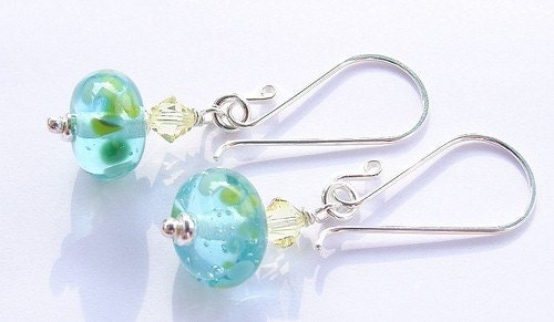 The lampwork beads were made by me using recycled glass from a Bombay Sapphire Gin bottle
