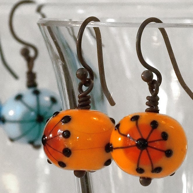 Retro hogweed earrings in citrus orange