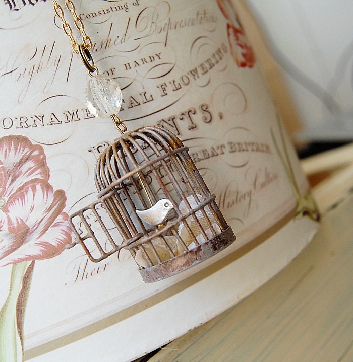 Very limited edition. Patina birdcage and little birdie.