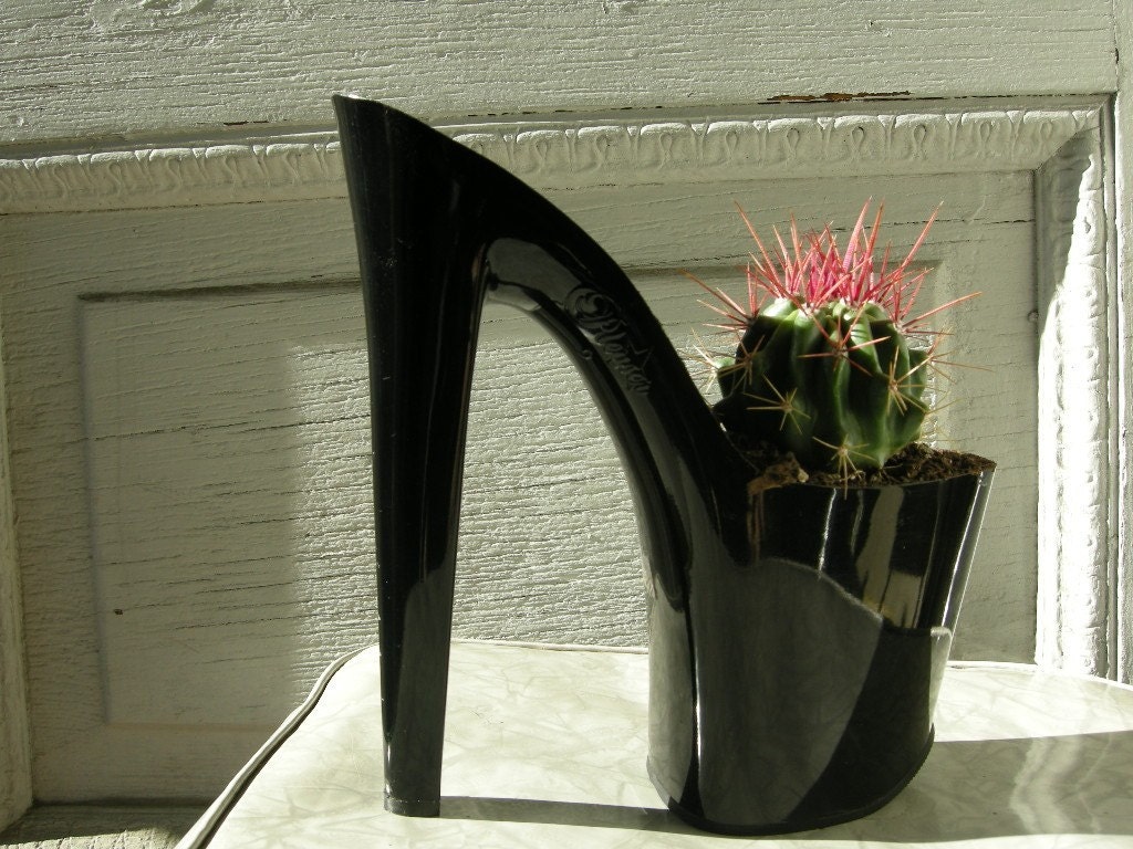 cacti planter made from a shiny black platform stiletto