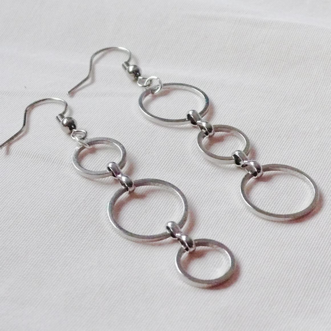 Silver asymmetric three hoop earrings
