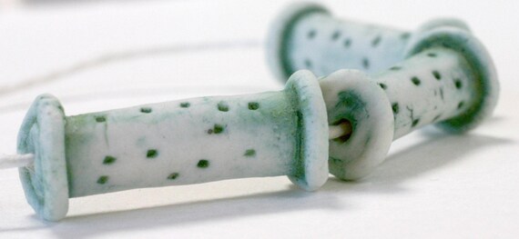 These unglazed beads have been finished in a lovely green stain giving a verdigris effect.