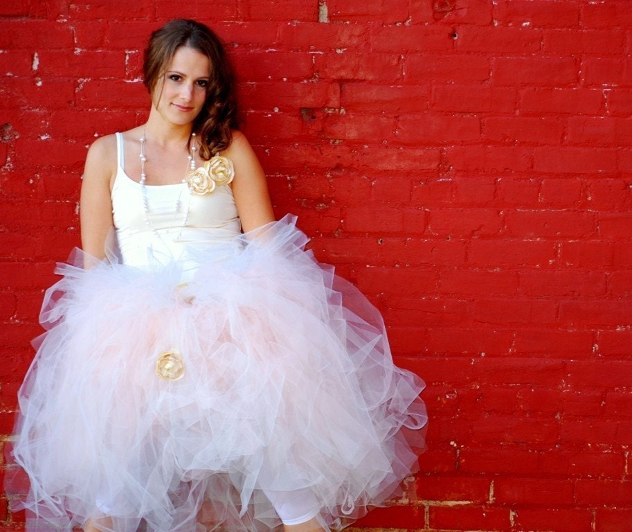 The tutu is made with yards upon yards of tulle cuttied then SEWN to a