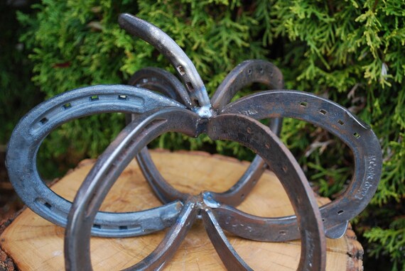 welded horseshoe art. 6 horseshoes make up the base,