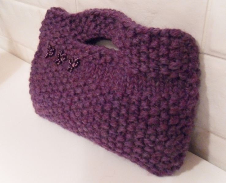 Hand knitted 100% woollen moss stitch purple clutch bag , felt lined.