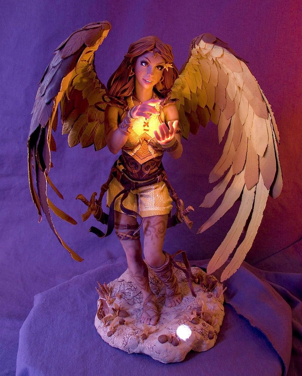 14 inch female figure with wings and illuminated hands
