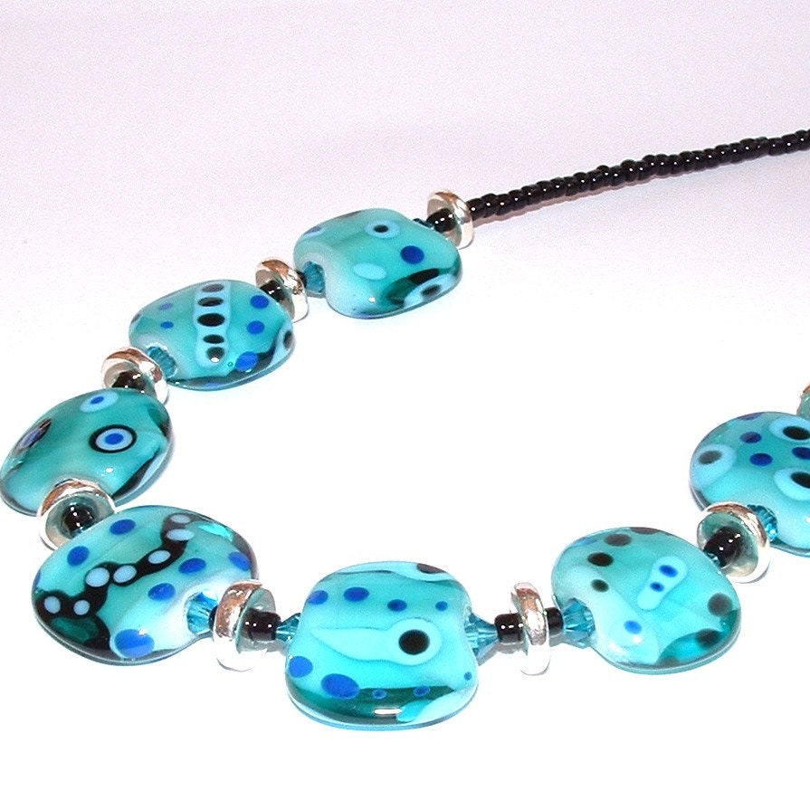 This necklace is made with lampwork beads made by me in my home studio.