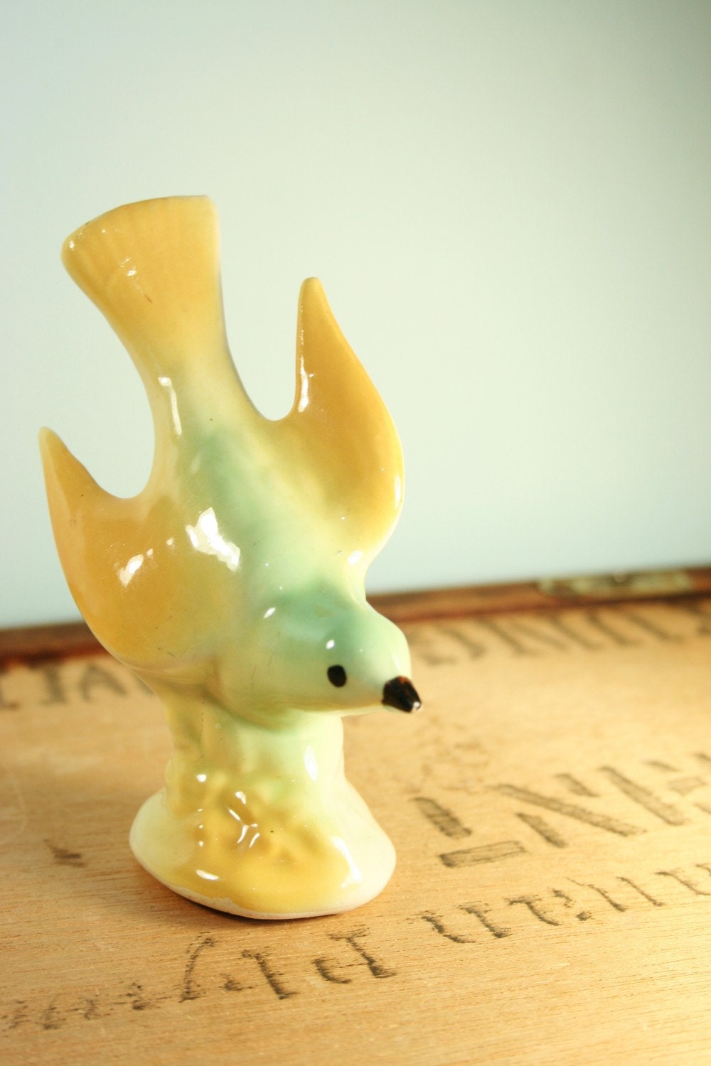 green and gold bird figurine