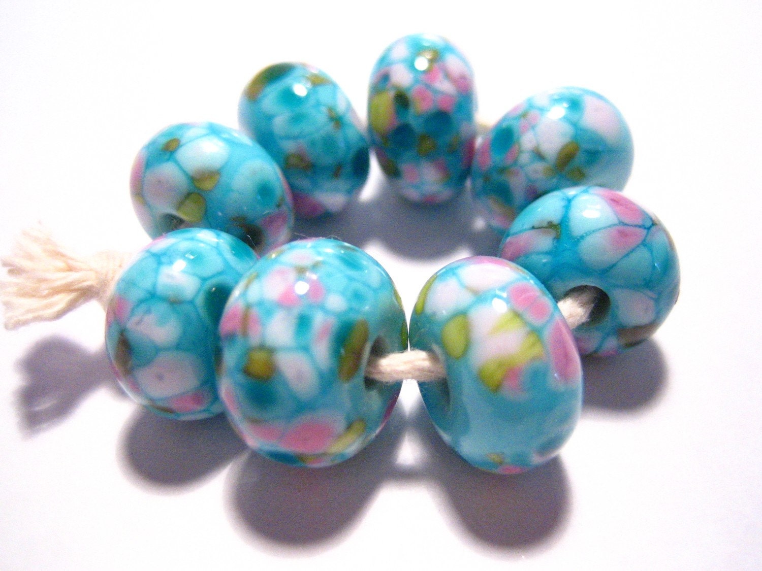 8 really pretty and shamelessly girly beads made by me, Rachel B, in my home studio in Cornwall.