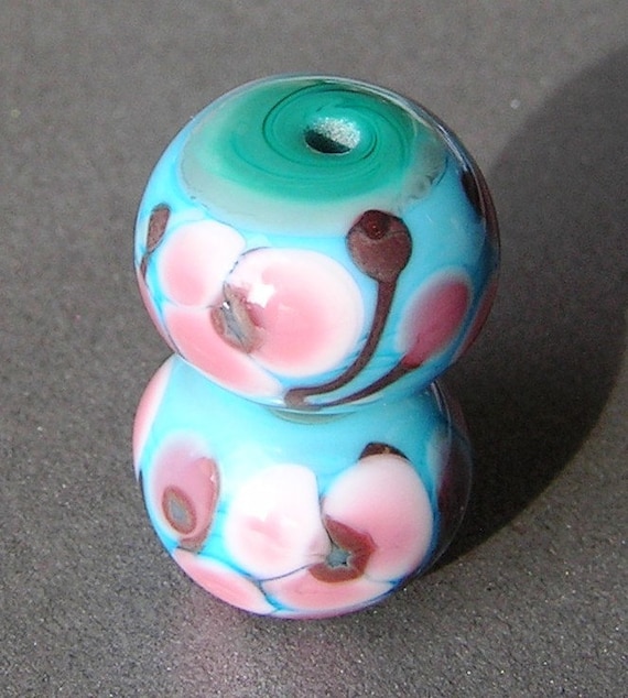 A pair of turquoise and green Lampwork beads with my Cherry Blossom design, suitable for earrings.
