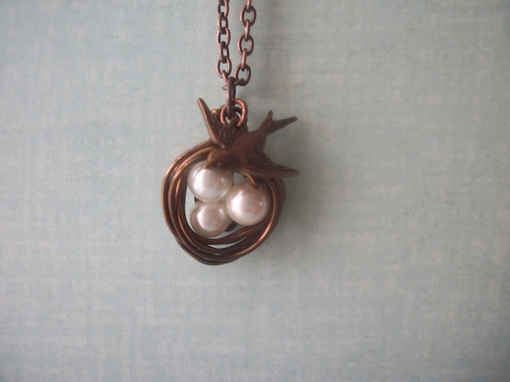 Bird nest pendant with bird charm