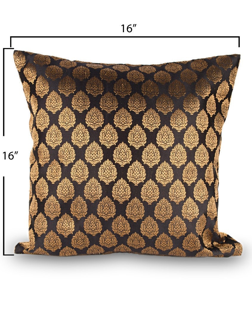 Traditional black brocade cushion cover with small golden motifs