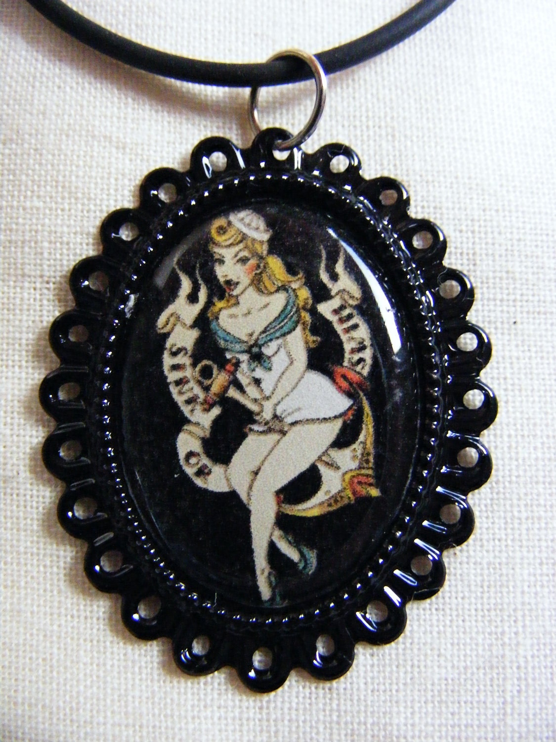 Rockabilly tattoo sailor jerry necklace pin-up girl. From thecutealternative