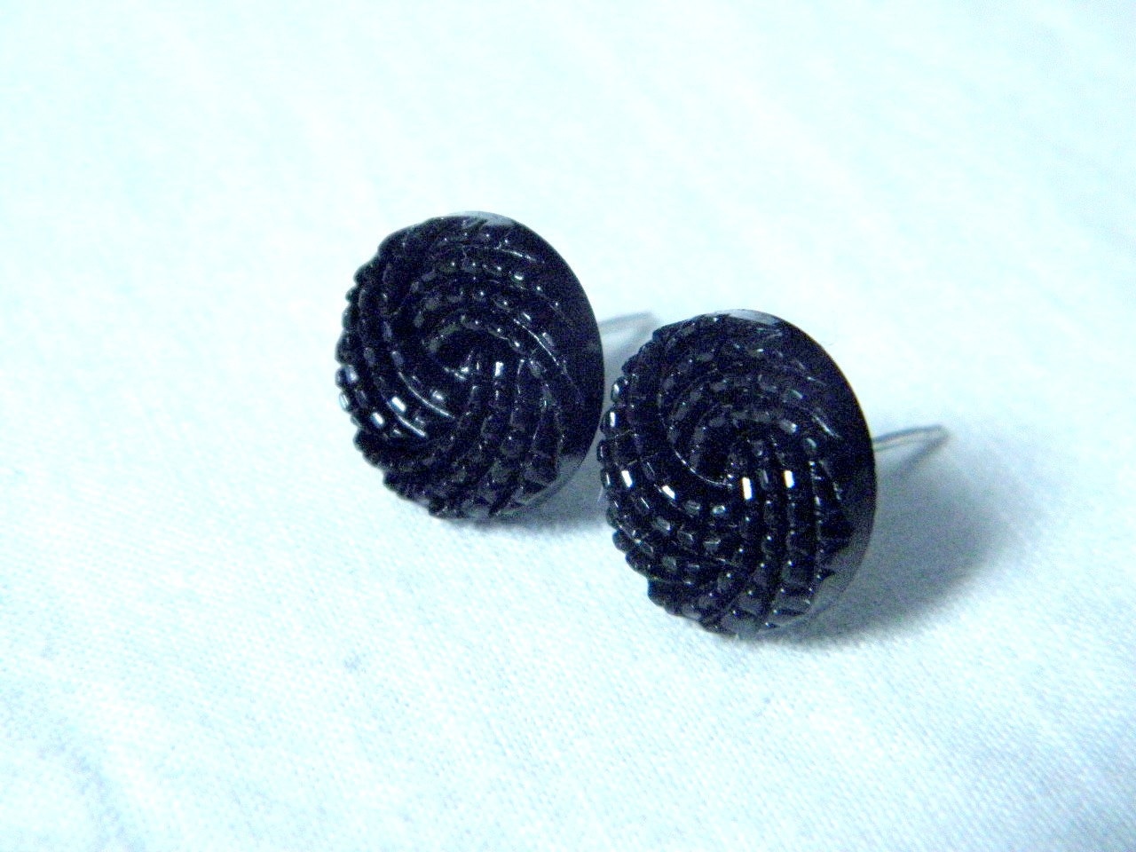 Plastic button earrings black color