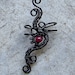 black and
                                    ruby wire wrapped ear cuff