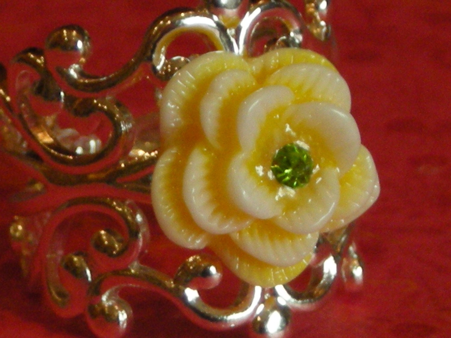 Silver scroll ring with buttery yellow rose