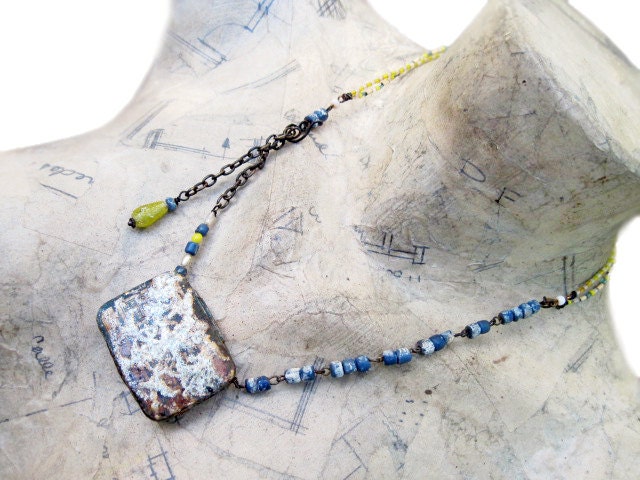 In a Little World. Rustic tin box with landscape assemblage necklace.