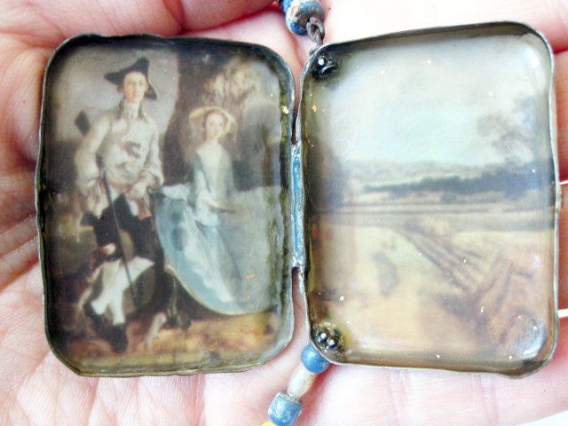 In a Little World. Rustic tin box with landscape assemblage necklace.