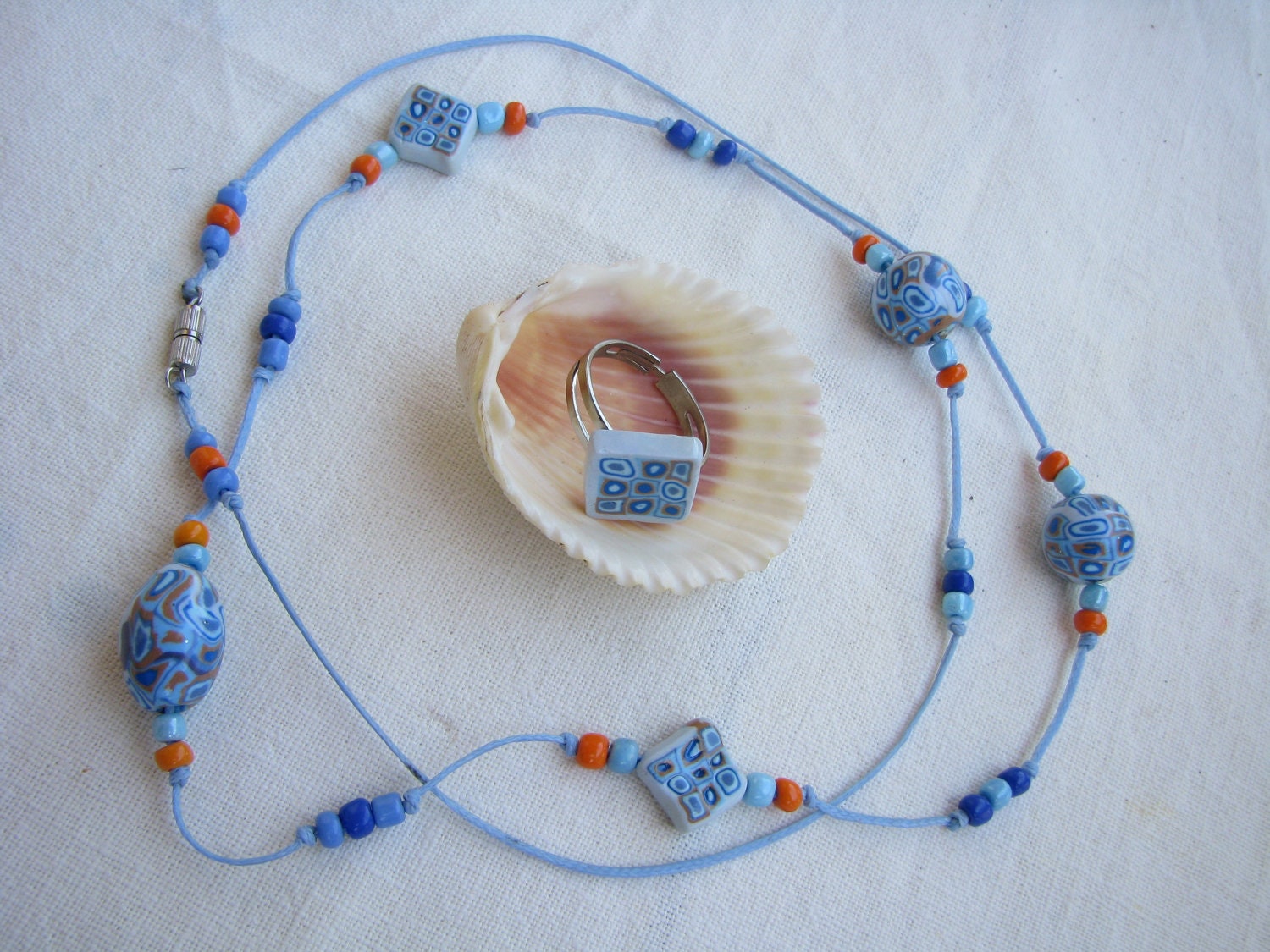 Necklace and ring, retro hippie in pastel blue, dark blue, gray blue and light brown - ocher