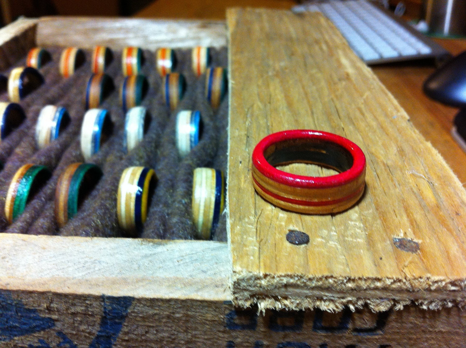 Rings with a pink stripe hand cut from skateboard decks